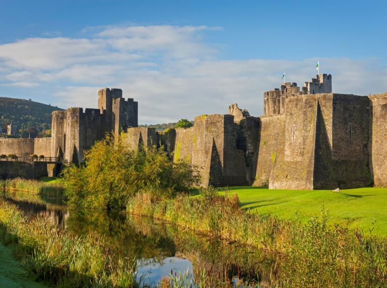 External shot of Caerphilly Castle with the moat in the foreground