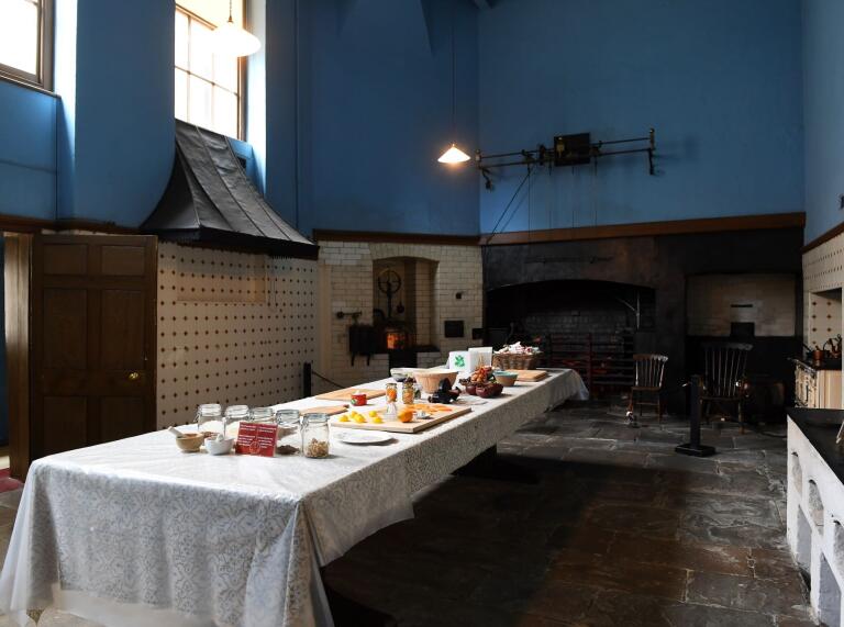 A table laid out with cooking ingredients in the Great Kitchen at Tredegar House.