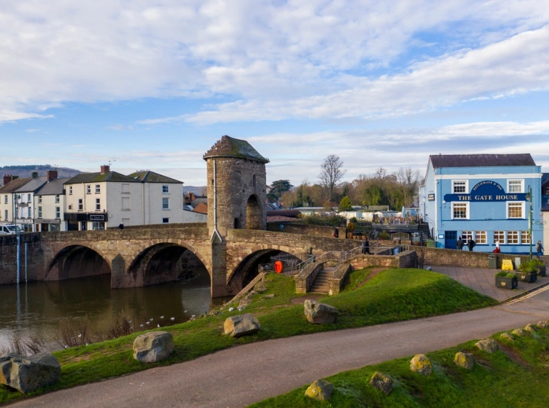 A bridge leading into a town.