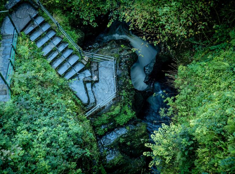 An aerial view of the steps leading down to a waterfall at Devil's Bridge.