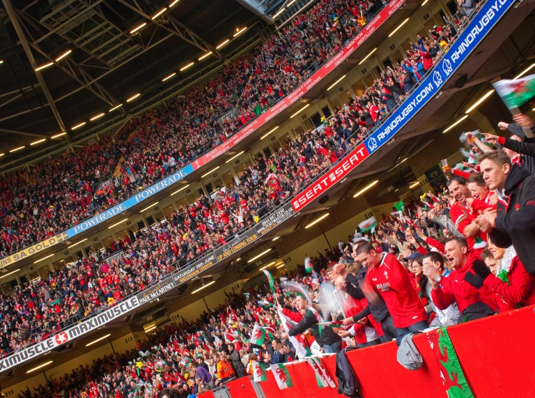 Crowds or supporters inside Principality Stadium watching Rugby World Cup.