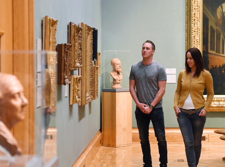 Couple exploring the galleries at National Museum Cardiff.