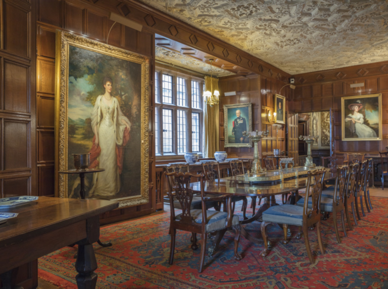 Dining Room in castle. Portrait of Violet Lane Fox, Countess of Powis by Ellis Roberts to the left.