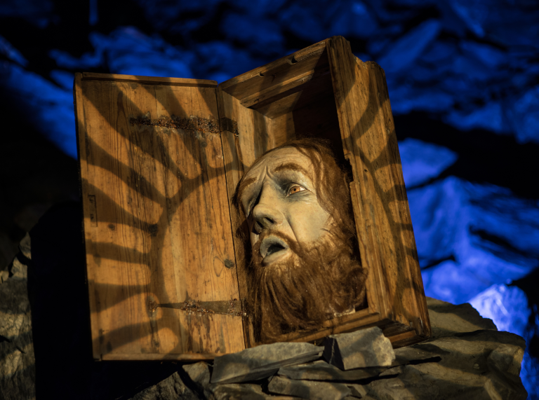 attraction at underground labyrinth showing man with mouth open