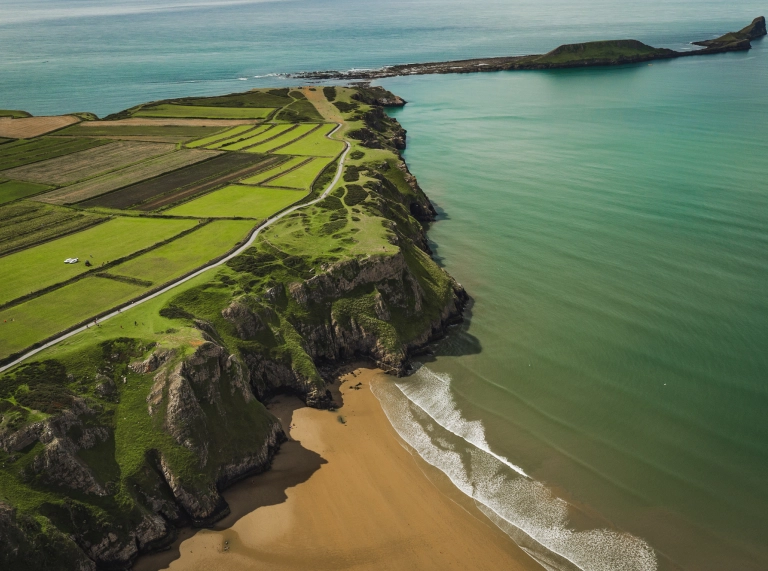 Aerial view of Rhossili beach and Worm's Head.