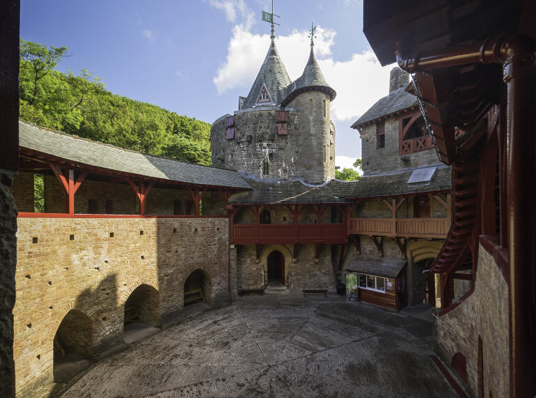 A castle courtyard with fairytale towers.