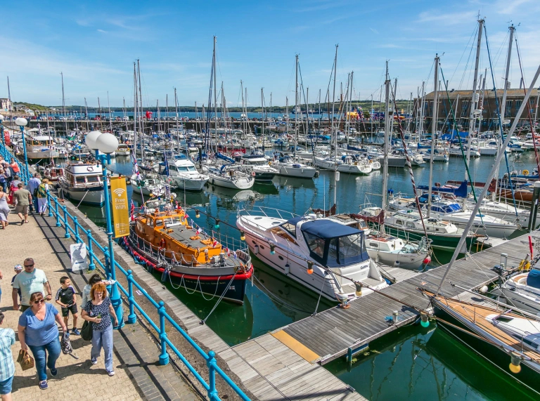 Boats in a harbour on a sunny day.