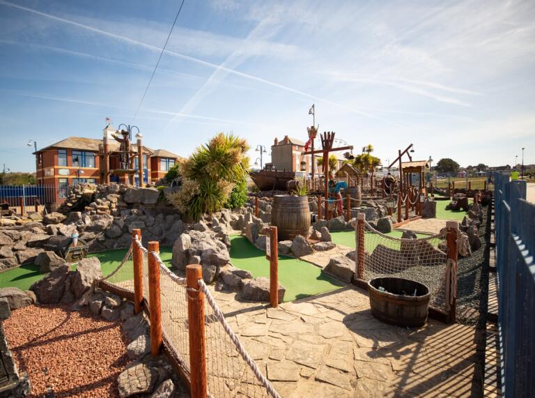 Rocks and barrels at a smugglers' cove adventure at Barry Island Pleasure Park