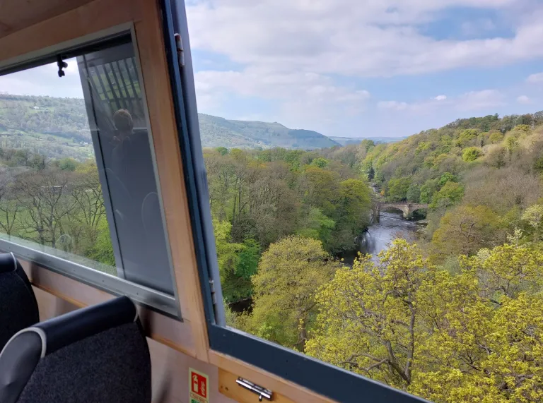 Views of a canal from a boat window on an aqueduct.