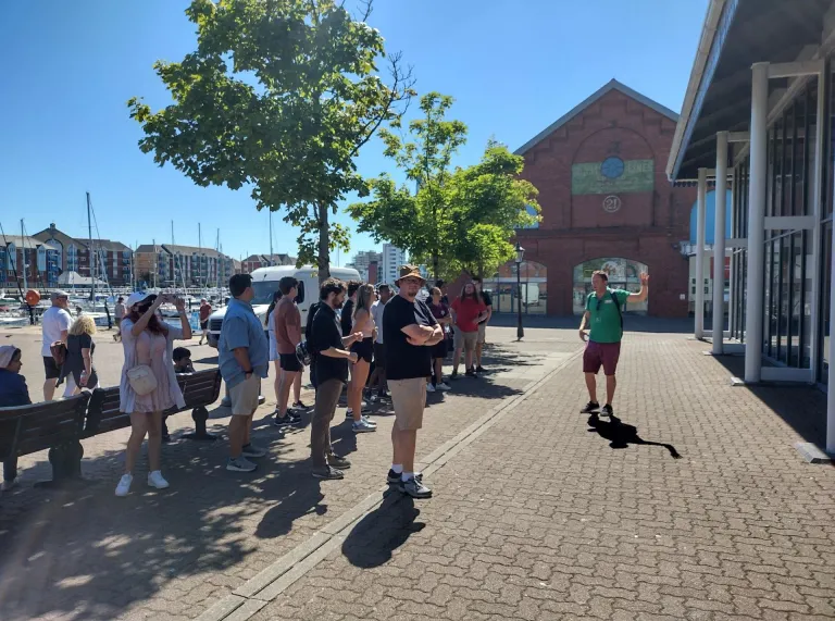 Group of people taking a tour around Cardiff.