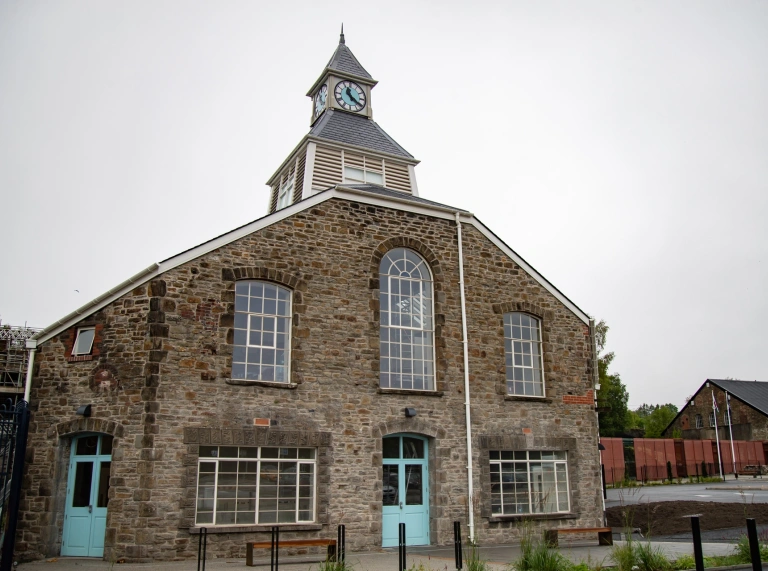 External shot of a restored copperworks powerhouse building.