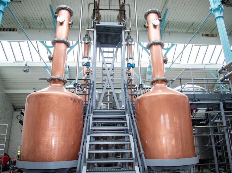 Two copper vats in a distillery.