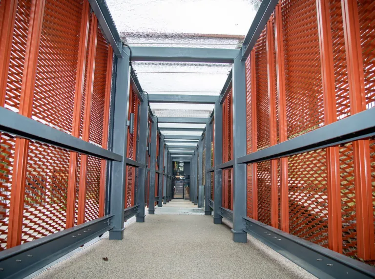 A walkway leading to a visitor centre in a distillery.