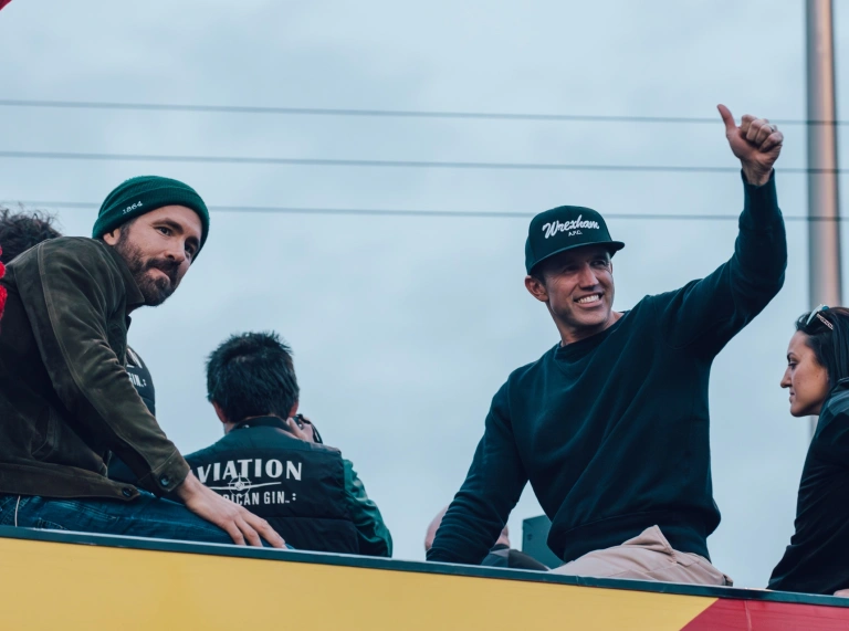Two Hollywood celebrities, on a football tour bus.