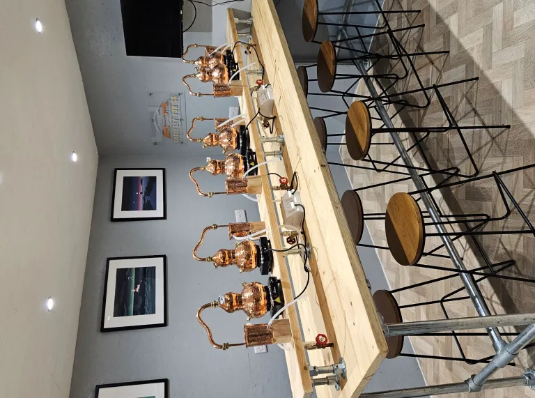 A taste testing table at a distillery.