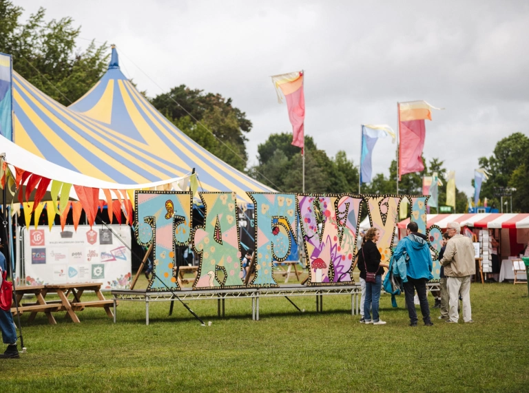 Tafwyl sign and performing tent at the festival.