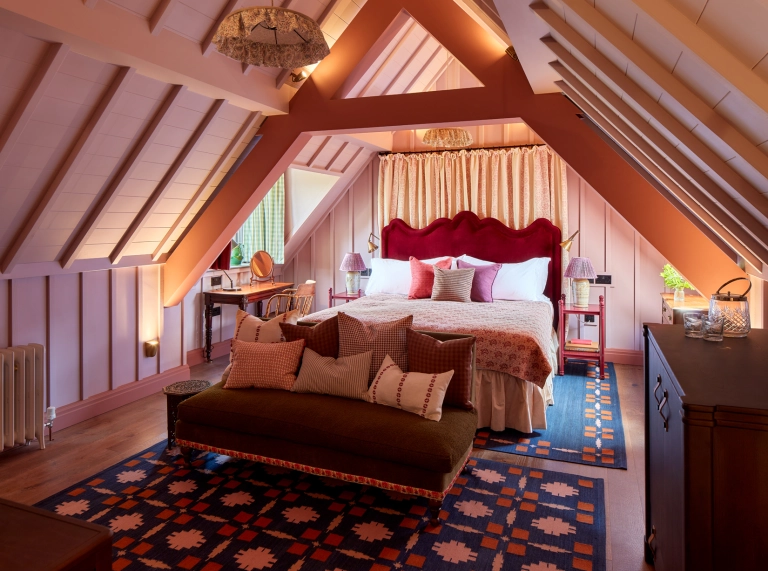Bedroom in the eaves of a luxury hotel.