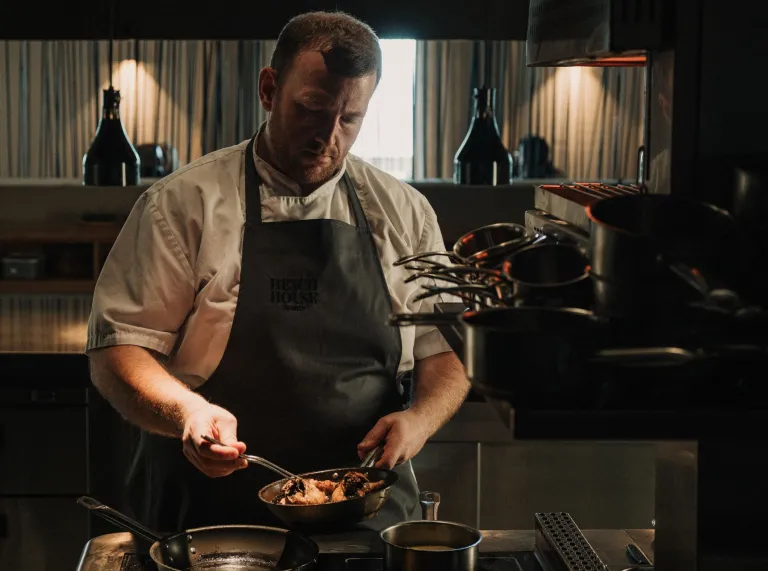 Chef Hywel in the kitchen of Beach House cooking.