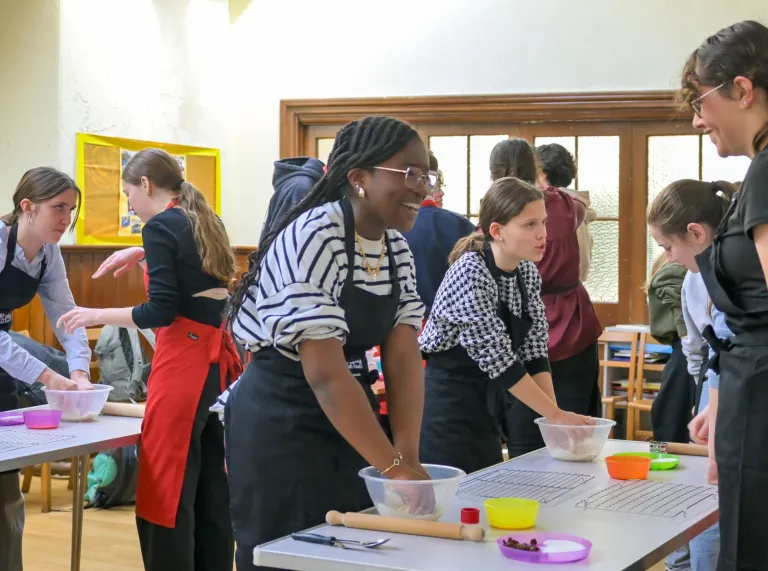 Group of ladies making welshcakes in a workshop.