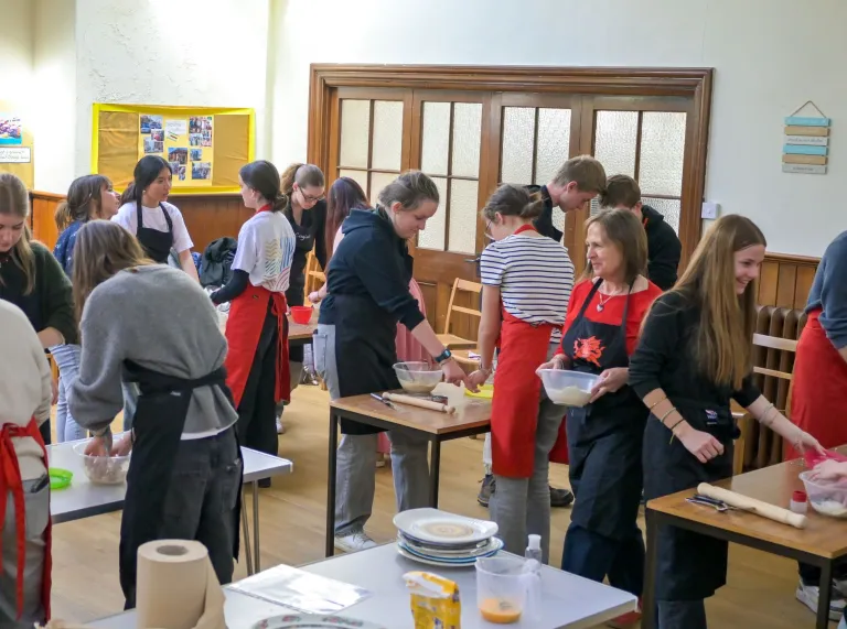Group of ladies making welshcakes in a workshop.