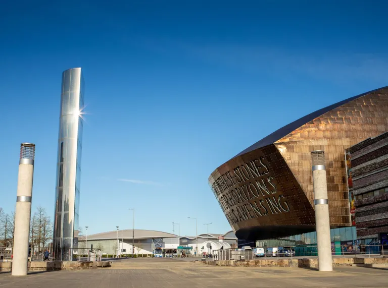 An entertainment centre next to a large silver water feature.