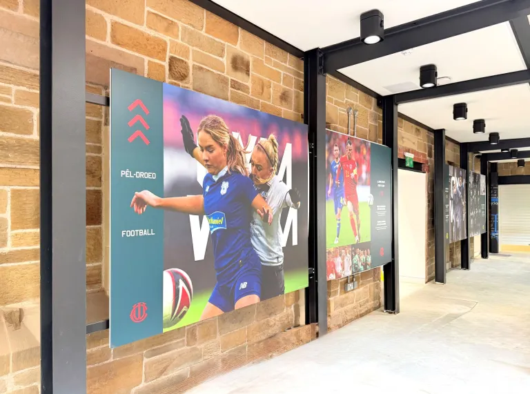 Display boards of footballers in a museum.