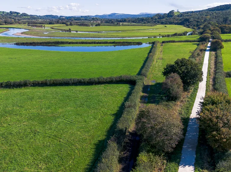 Views of the countryside with an estuary running through the fields