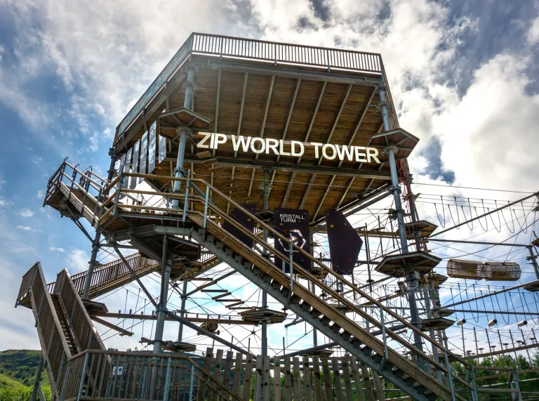 Activity tower with platforms and zip lines.