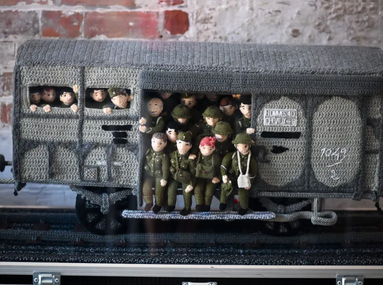 Wartime train wagon filled with soldiers made from wool.