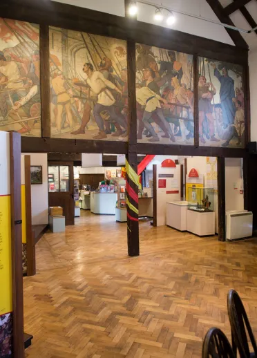 Mural above the entrance to the shop at Owain Glyndwr Centre.