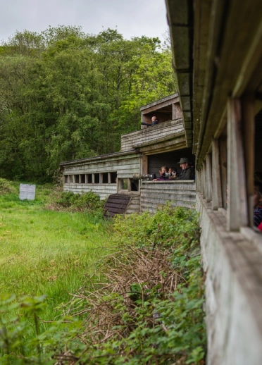 People in a large bird watching hide.