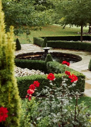 Fountain, flowers and hedges at Bodnant Garden.
