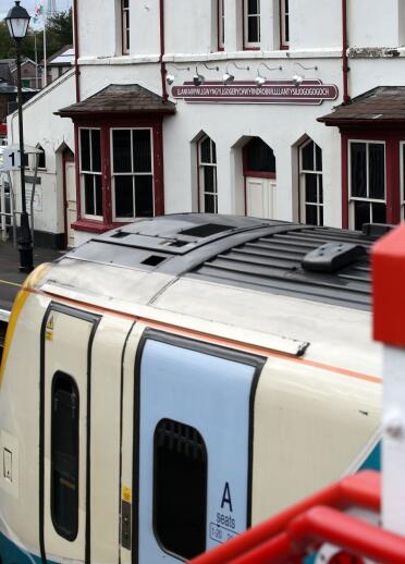 A train pulling into Llanfair PG station, 