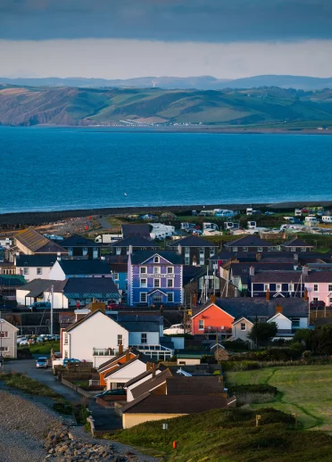 View of Aberaeron and its colourful houses in front of the sea.
