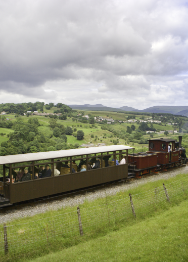 Brecon Mountain Railway steam train travelling through the Brecon Beacons.