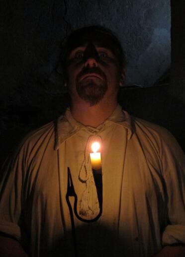 A ghostly image of a peasant in candlelight at Llancaiach Fawr.