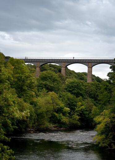 Image of the aqueduct and trees and river below