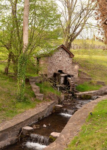 A water mill and running stream.