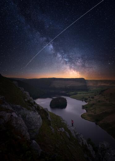 Elan Valley and Milky Way above person in Elan Valley