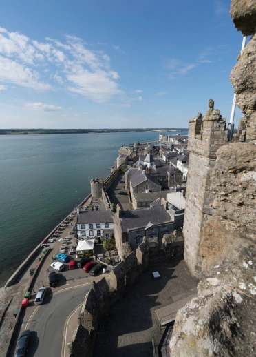 View of a town wall from the turret of a castle.
