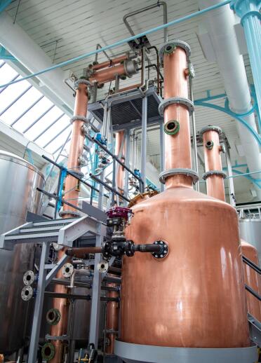 A copper vat in a distillery.