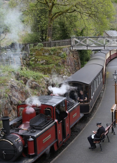 Ffestiniog Railway steam train arriving at Tan y Bwlch Station.