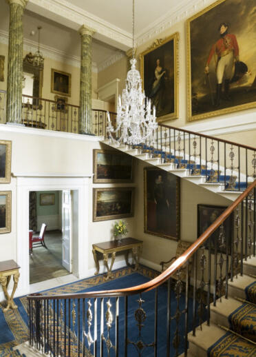 C18th Neo-classical with cantilevered stairs and a wrought iron, and partly gilt bronze, balustrade at Plas Newydd.