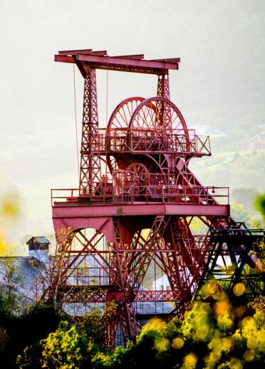 A mining winding tower in a former colliery at sunrise.