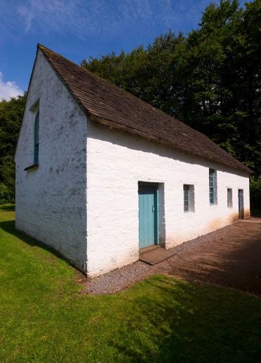An old stone white church building.