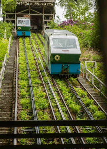 Funicular railway moving up and down a steep hill.