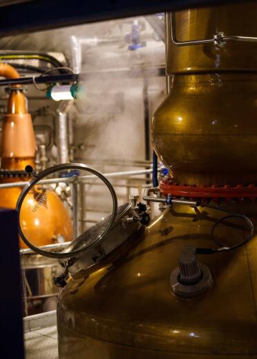 A vat in a gin making distillery