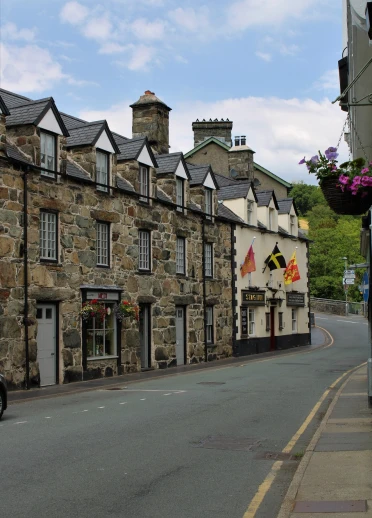 A shop and pub on a high street.