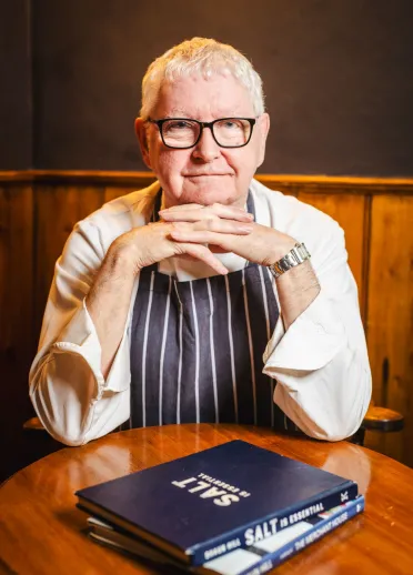 A chef posing for the camera.