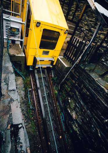 A carriage going down into a slate cavern.